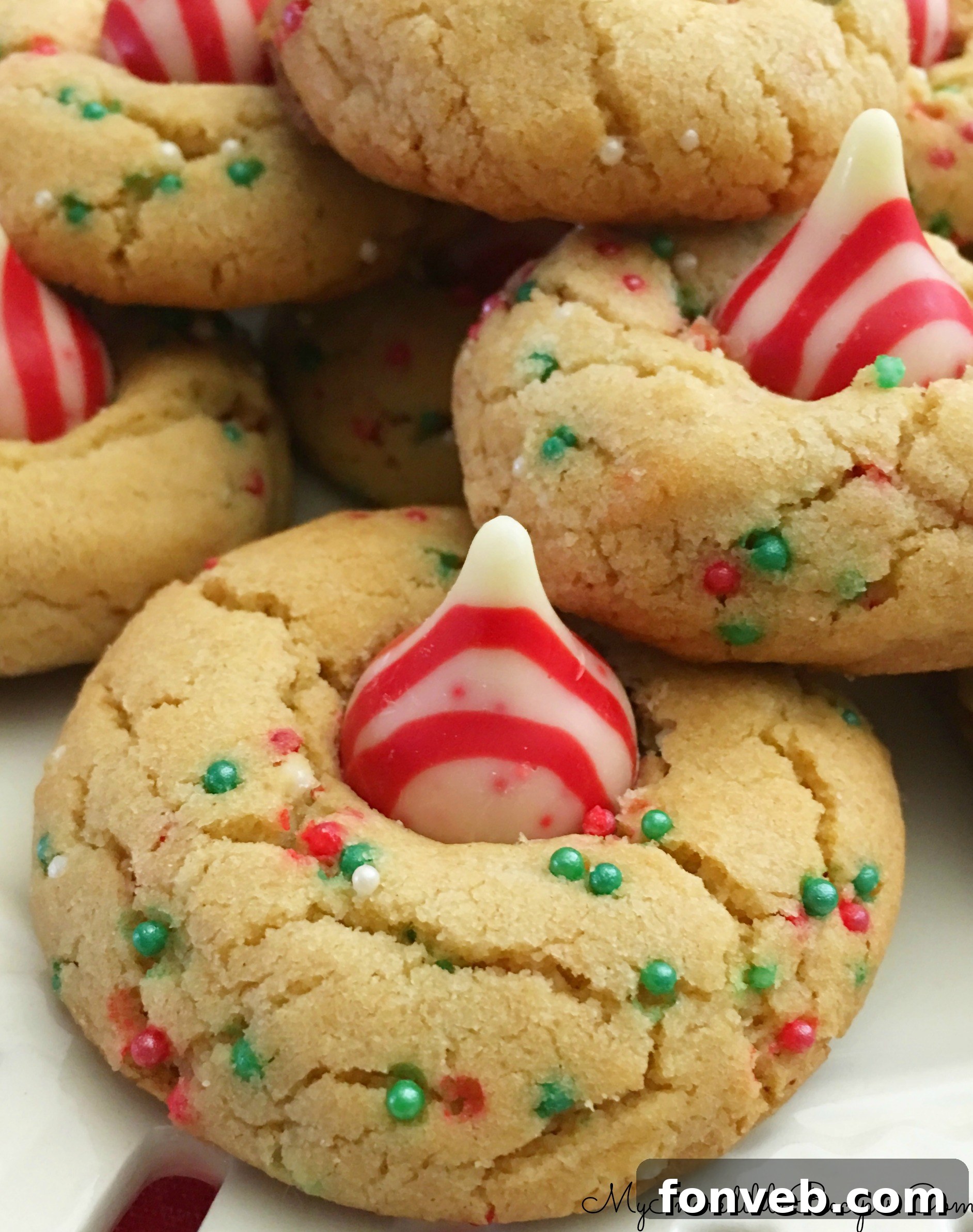 Peppermint Hershey's Kisses on festive cookies