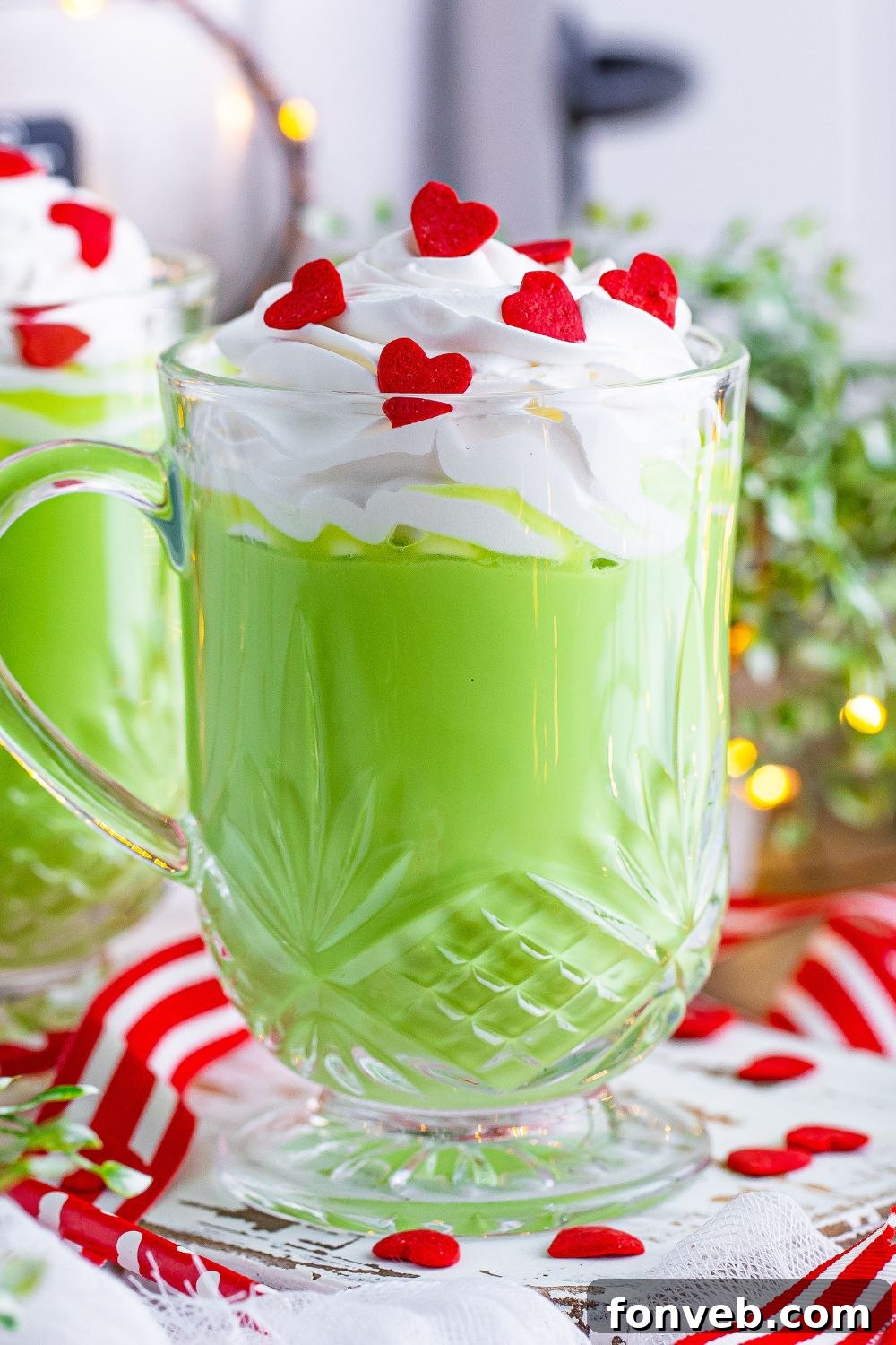 Grinch hot chocolate in a mug on a table, ready to be served