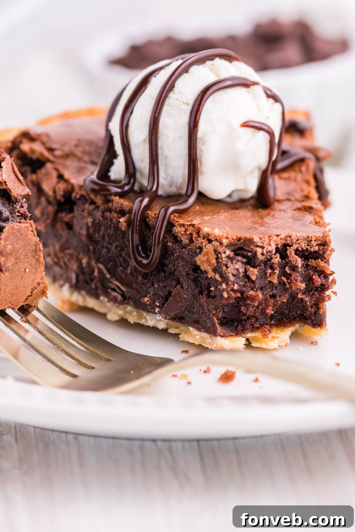Fudgy Brownie Pie Perfection 2 Fudge Brownie Pie with a slice cut out, showcasing its rich, dense texture.