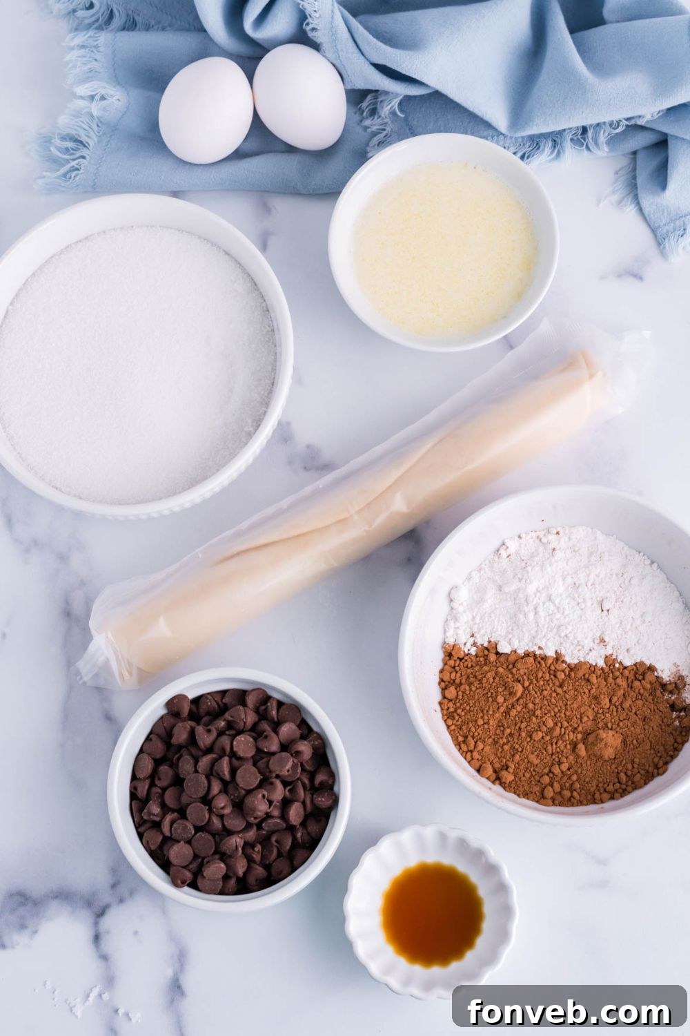 Fudgy Brownie Pie Perfection 5 All the ingredients for fudge brownie pie neatly laid out on a table.