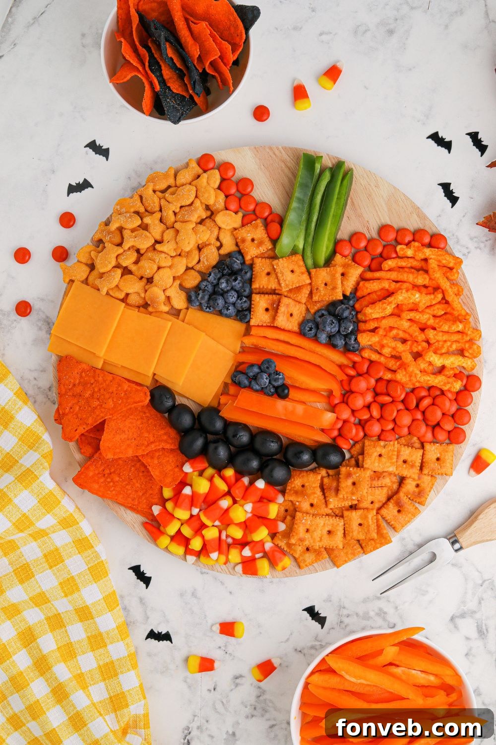 A festive pumpkin veggie tray, offering a healthy and colorful snack option.