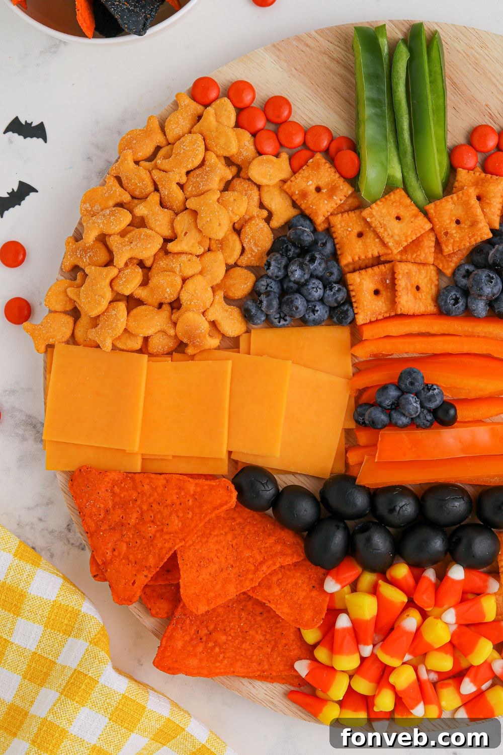 A charming Halloween snack board featuring a variety of treats, perfect for festive gatherings.