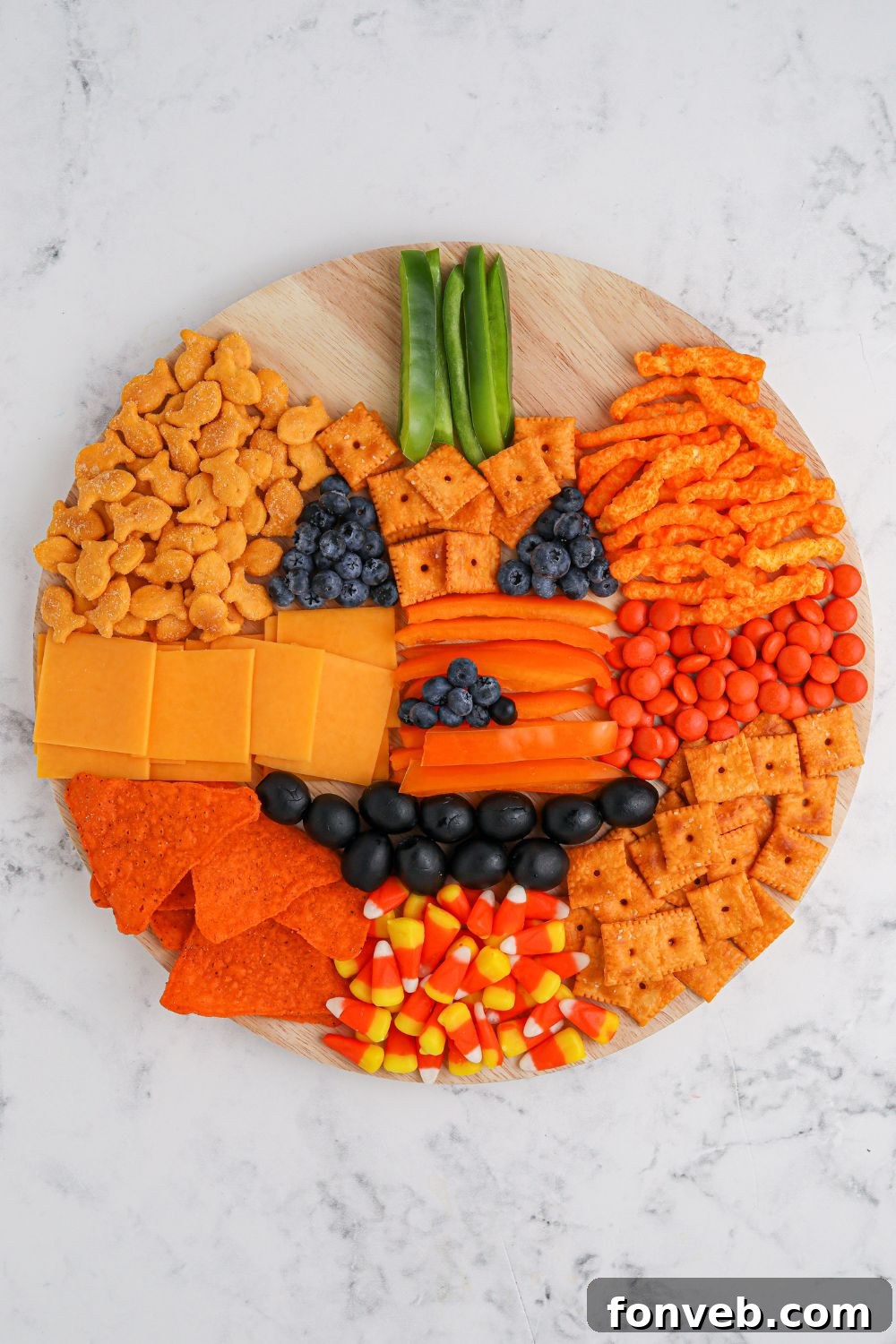 The finished look of the Pumpkin Charcuterie Board, fully assembled and ready to serve.