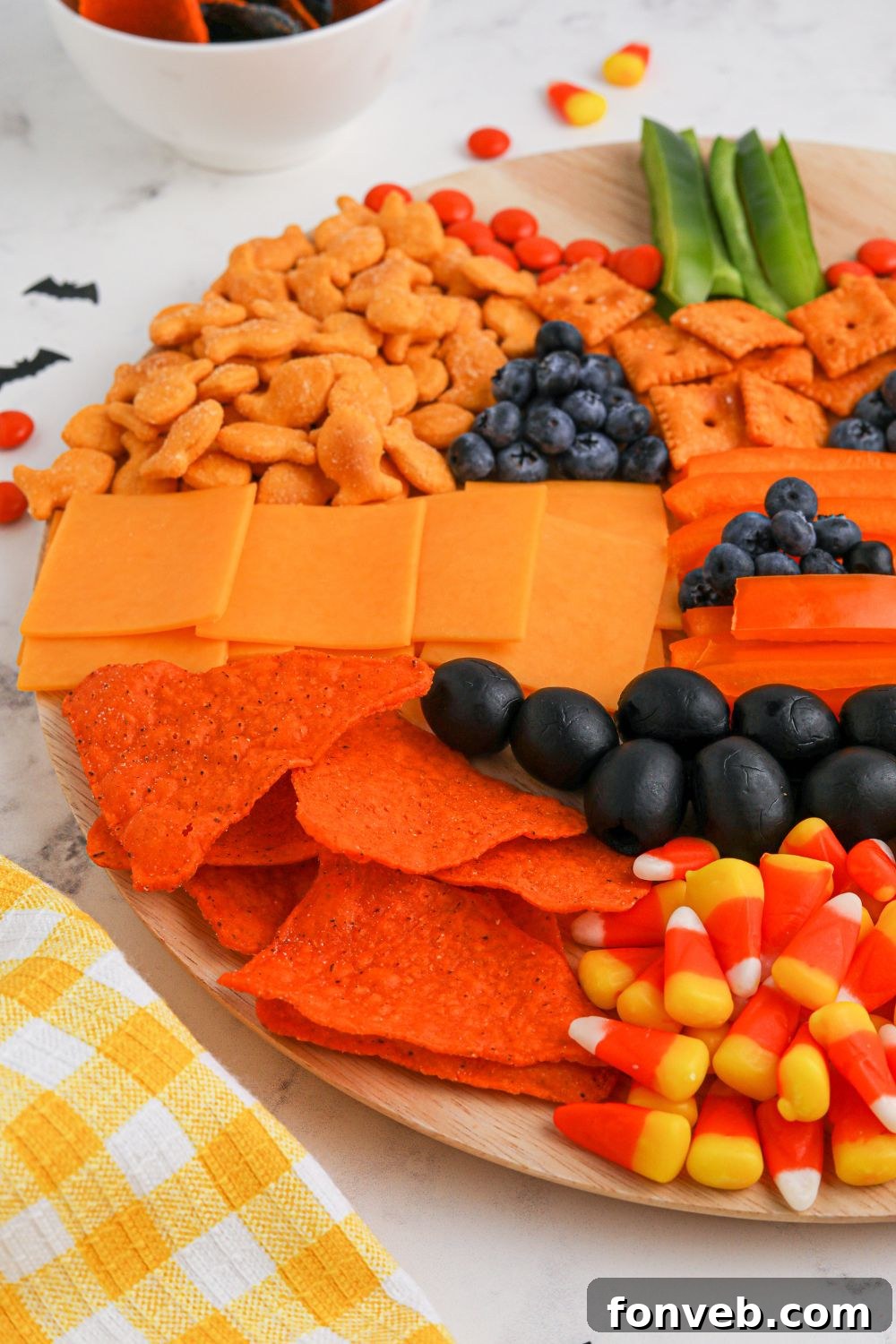 Side view of the impressive Pumpkin Charcuterie Board, highlighting its depth and arrangement.