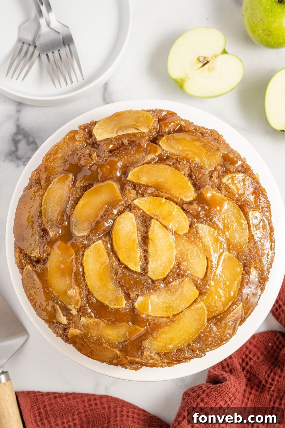 Caramelized Apple Bliss Cake 12 An overhead shot of a perfectly baked Apple Upside Down Cake on a cooling rack, showing its beautiful caramelized top