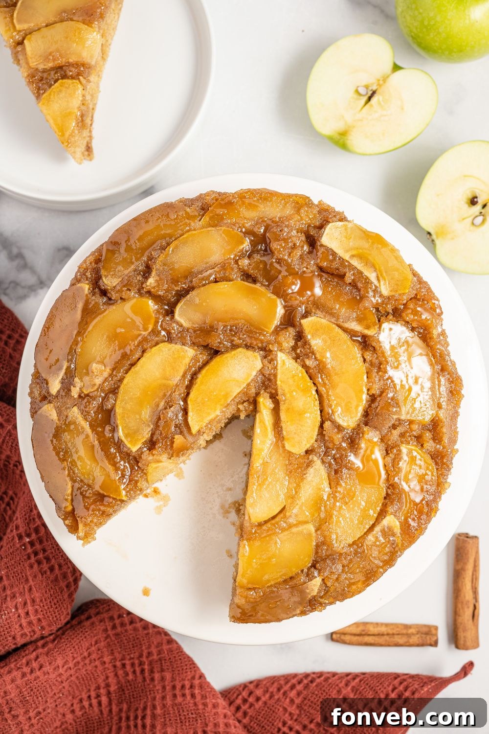 Caramelized Apple Bliss Cake 21 A direct overhead shot of the beautifully arranged apple upside down cake on a pristine white plate