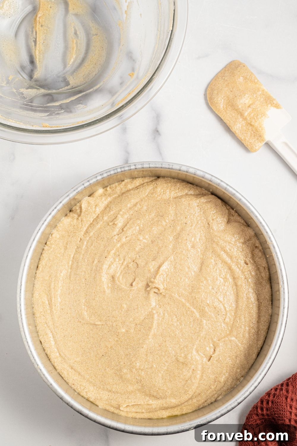 Caramelized Apple Bliss Cake 10 Smooth cake batter poured evenly over the apple slices in the cake pan