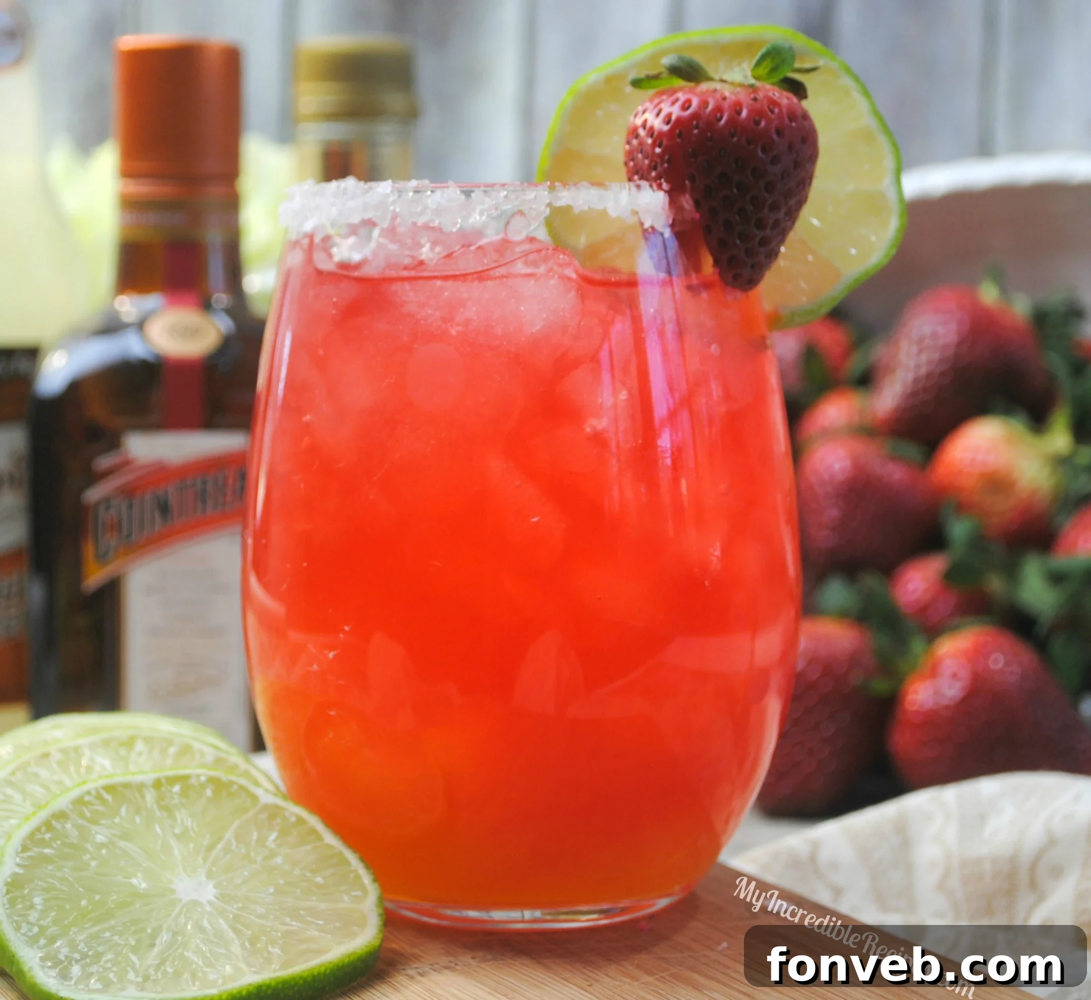 Refreshing Strawberry Margarita Punch with lime garnish.