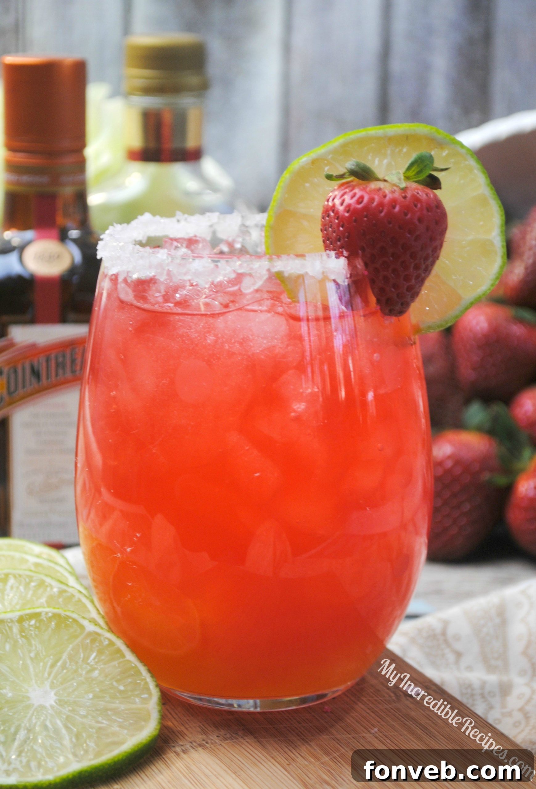 Close-up of fizzy Strawberry Margarita Punch in a glass.