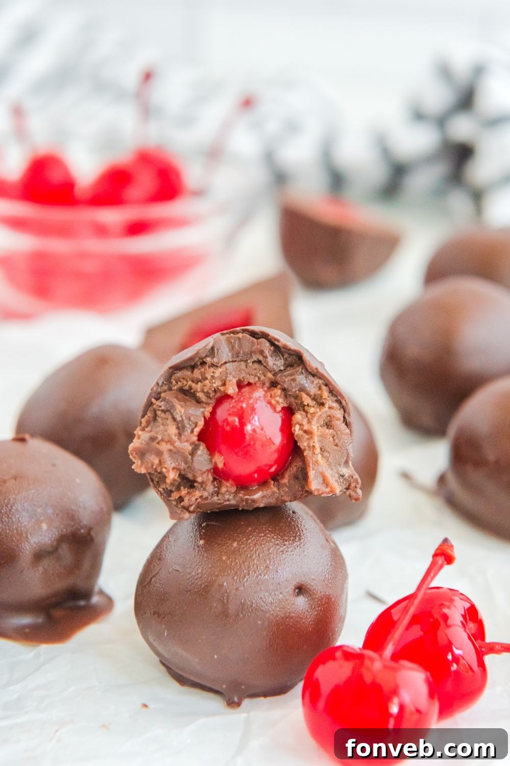 Stack of finished chocolate brownie cherry bombs displayed on a table