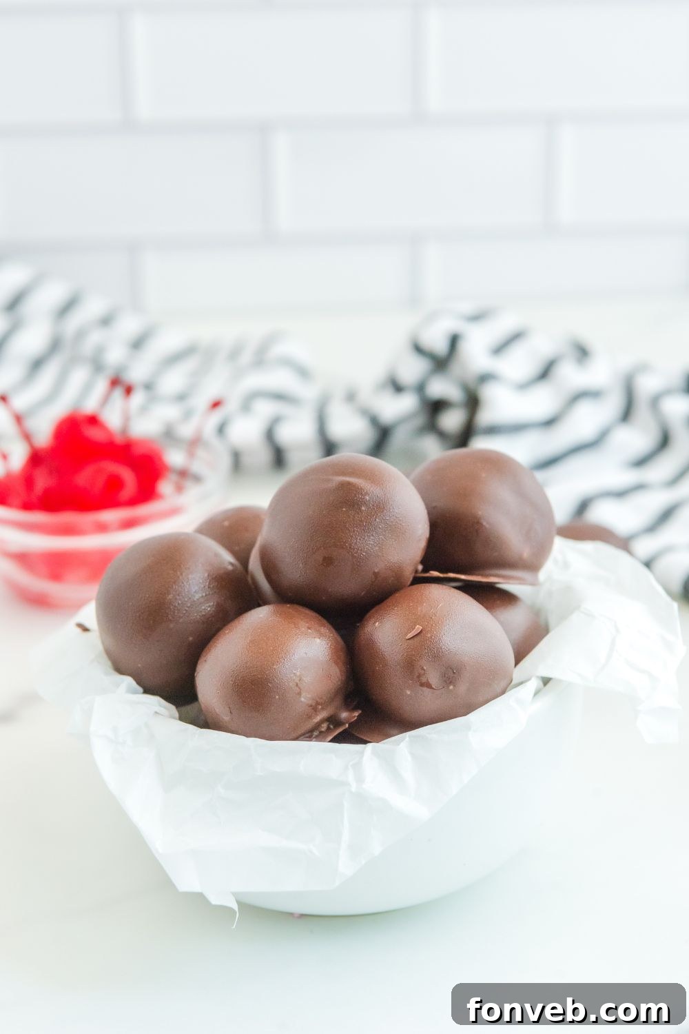 Bowl of cherry brownie truffles on a table, ready for serving