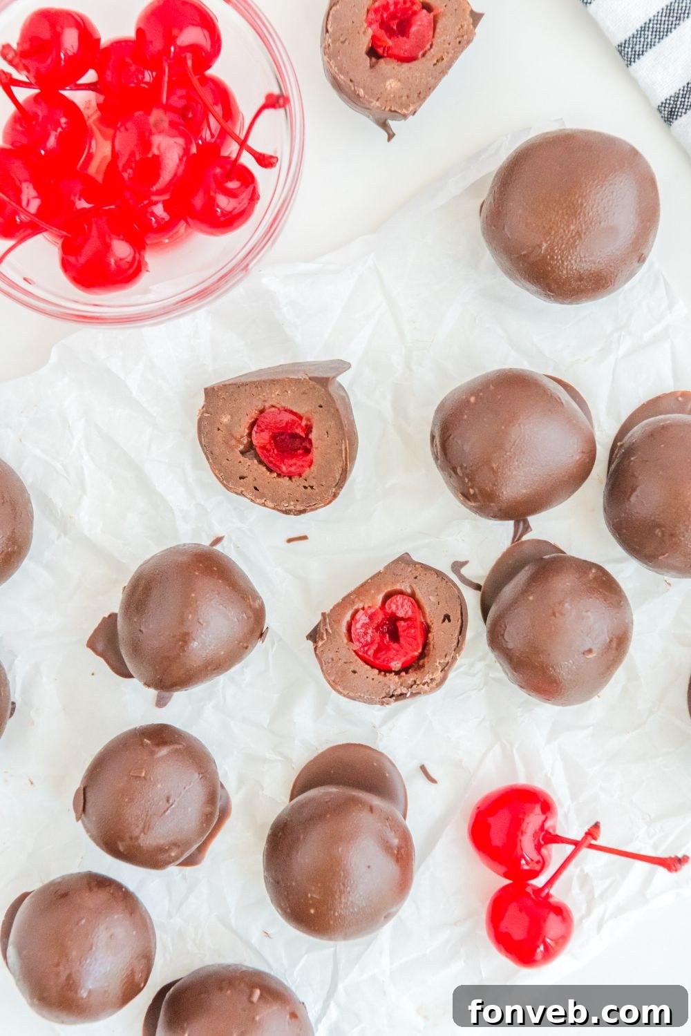A display of Cherry Brownie Bombs on a table, perfectly coated and arranged