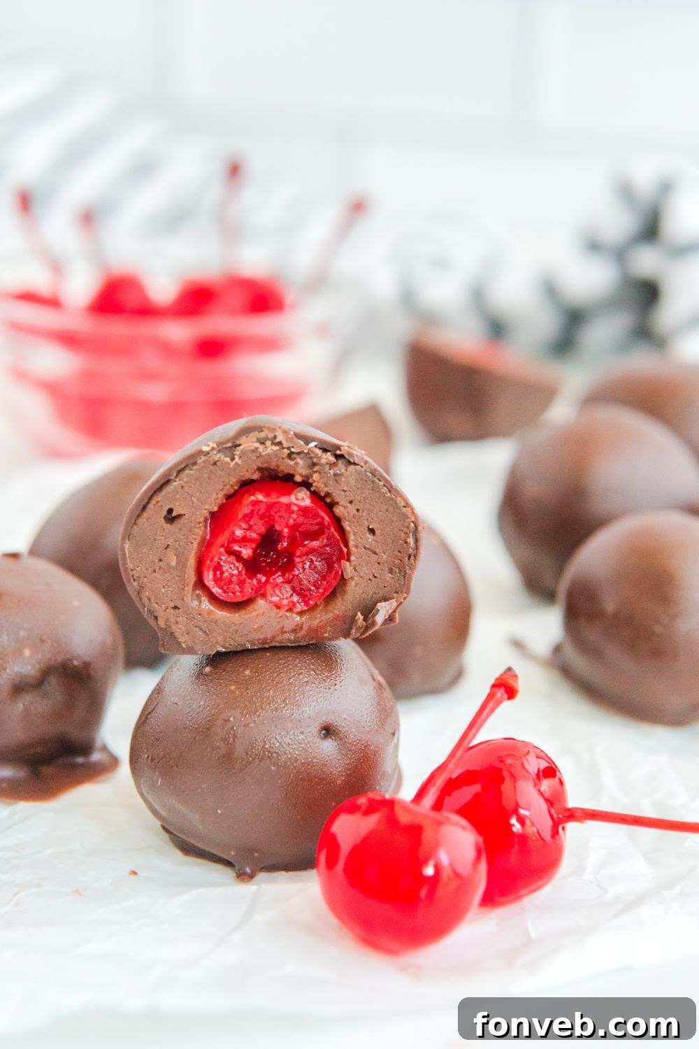 Cherry Brownie Bites cut and neatly stacked on a kitchen counter