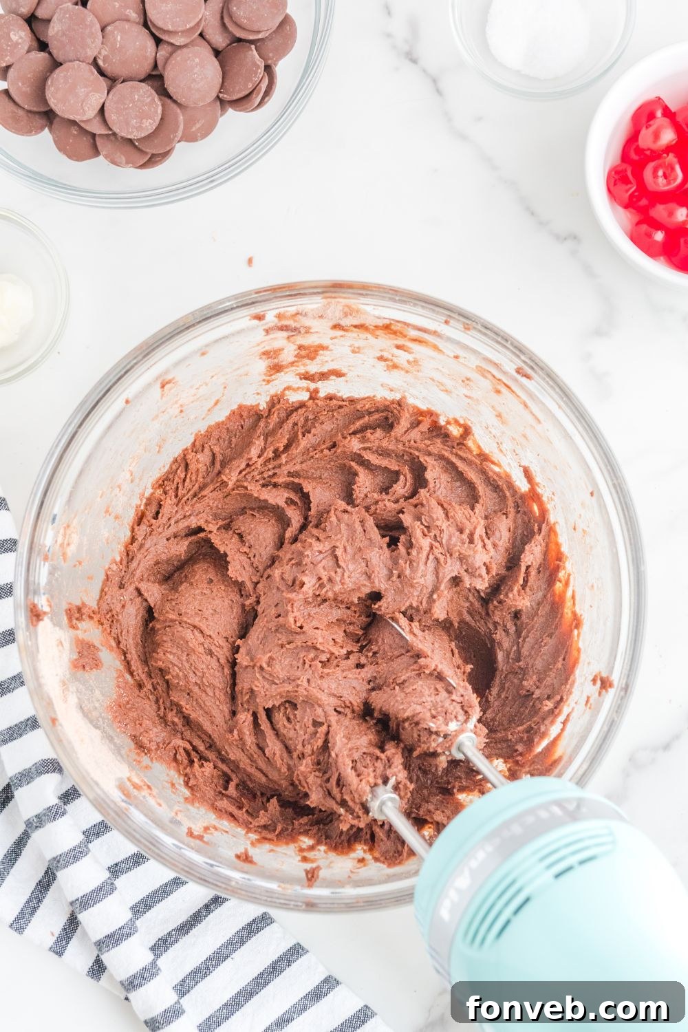 Mixing brownie batter in a bowl with an electric mixer