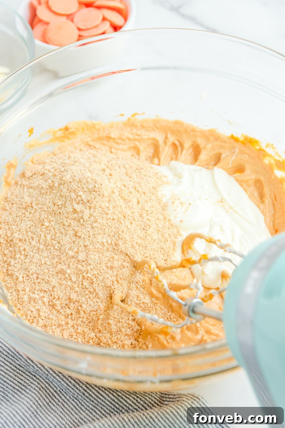 Pumpkin mixture with crushed graham crackers blended in, showing a textured, rich filling.