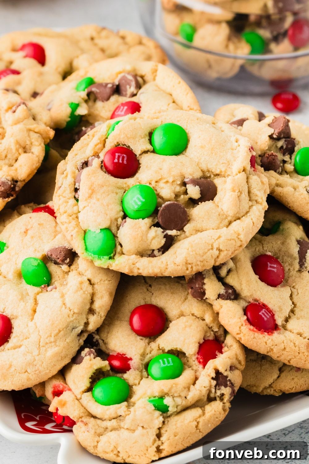 Festive M&M Delights 23 A colorful array of Christmas M&M cookies presented on a decorative platter, perfect for sharing at holiday gatherings