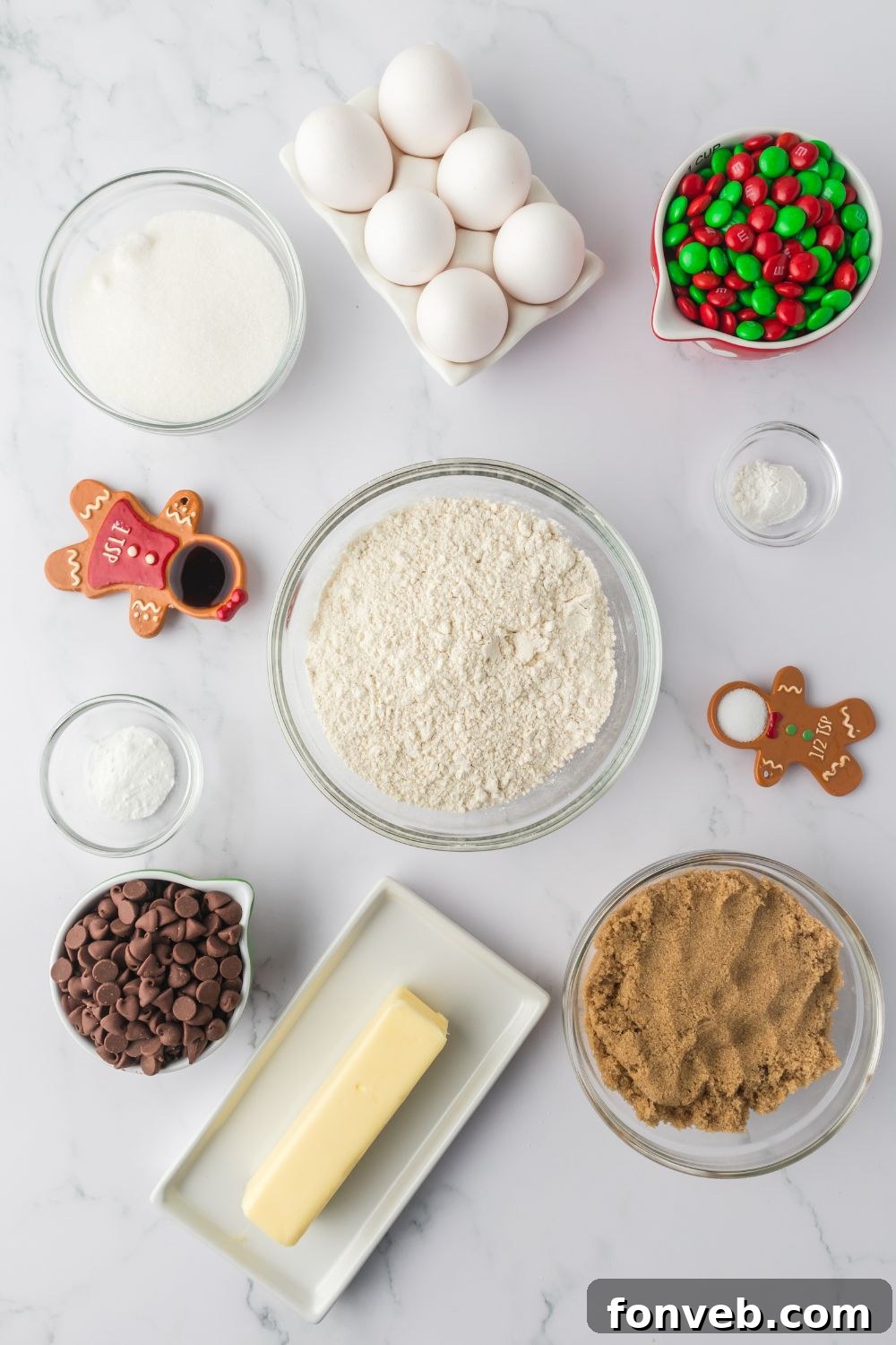 Festive M&M Delights 5 Ingredients for Christmas M&M cookies laid out in bowls on a rustic table, ready for baking