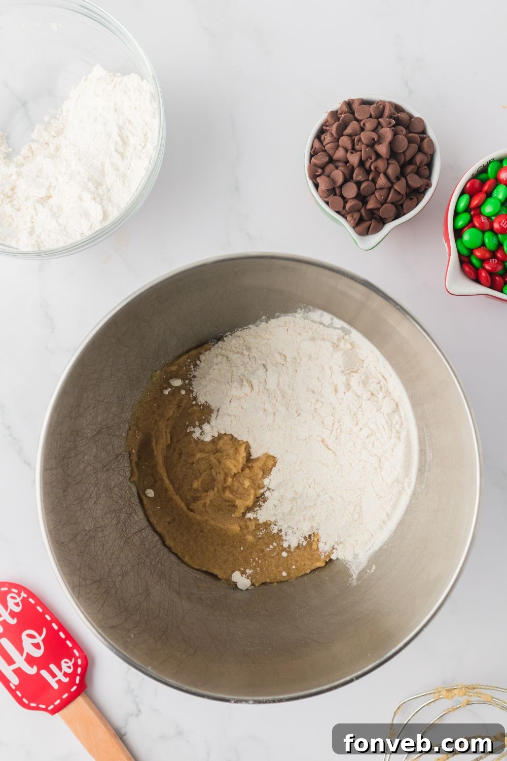 Festive M&M Delights 8 Creamy, golden cookie dough in a stand mixer bowl after all wet ingredients are combined