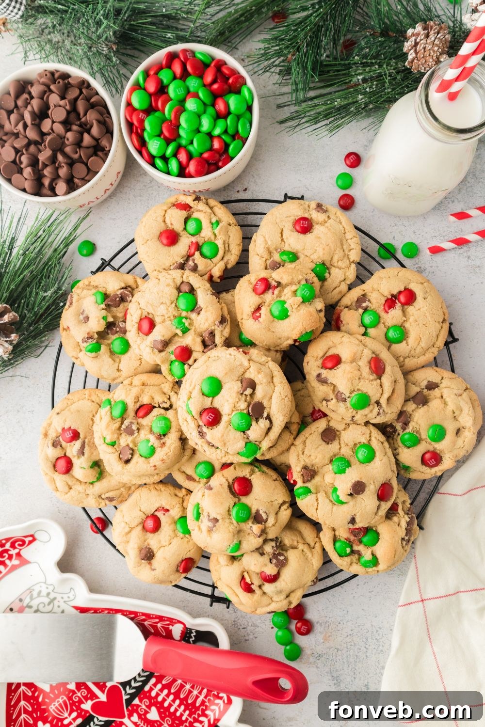 Festive M&M Delights 10 A festive platter of Christmas M&M cookies adorned with holiday candies and colorful M&Ms, making a cheerful display