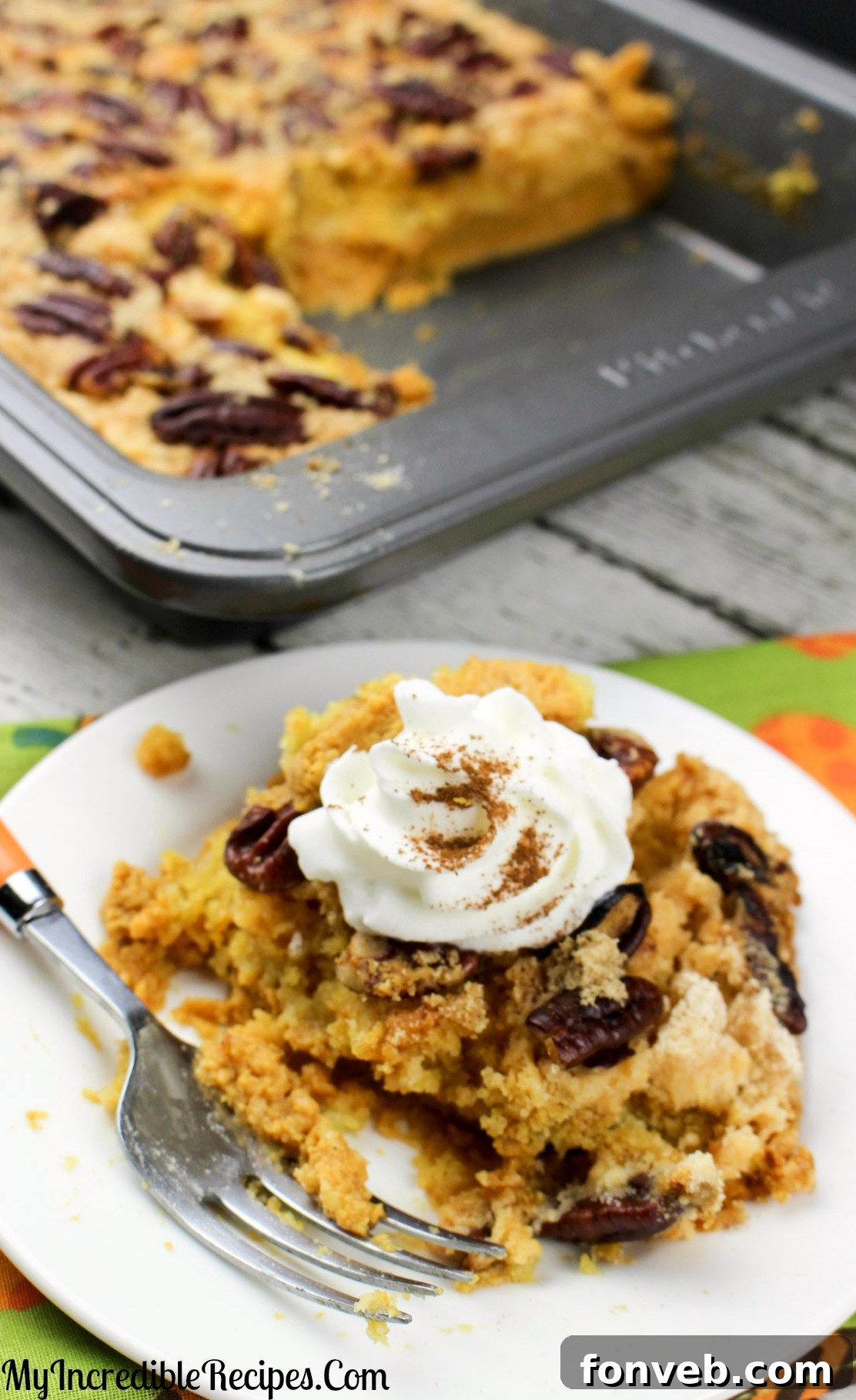 Easy Pumpkin Pecan Dump Cake 13 A large serving of Pumpkin Pecan Dump Cake on a plate
