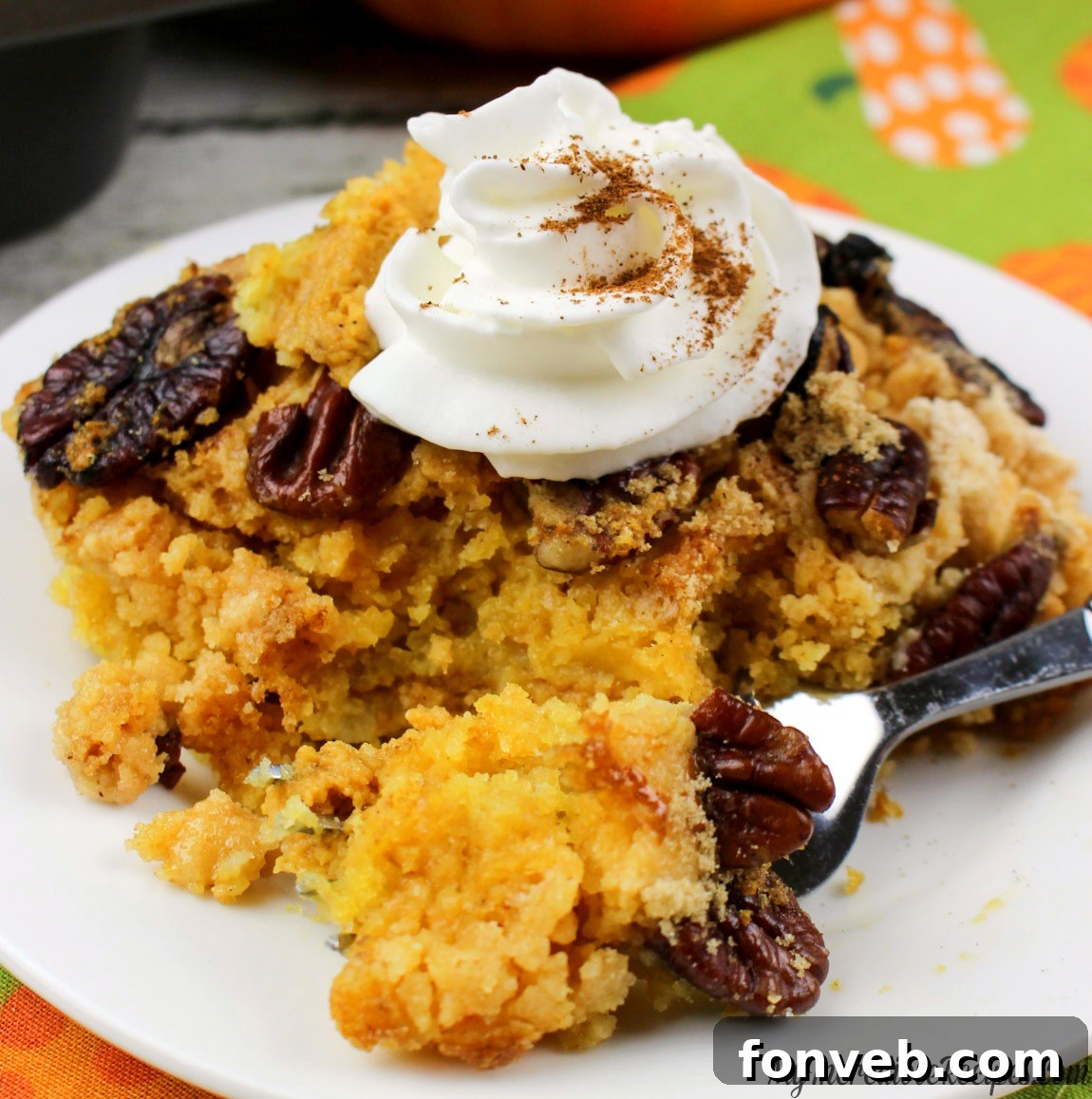 Easy Pumpkin Pecan Dump Cake 15 Close-up of a slice of moist Pumpkin Pecan Dump Cake showing the tender cake layer