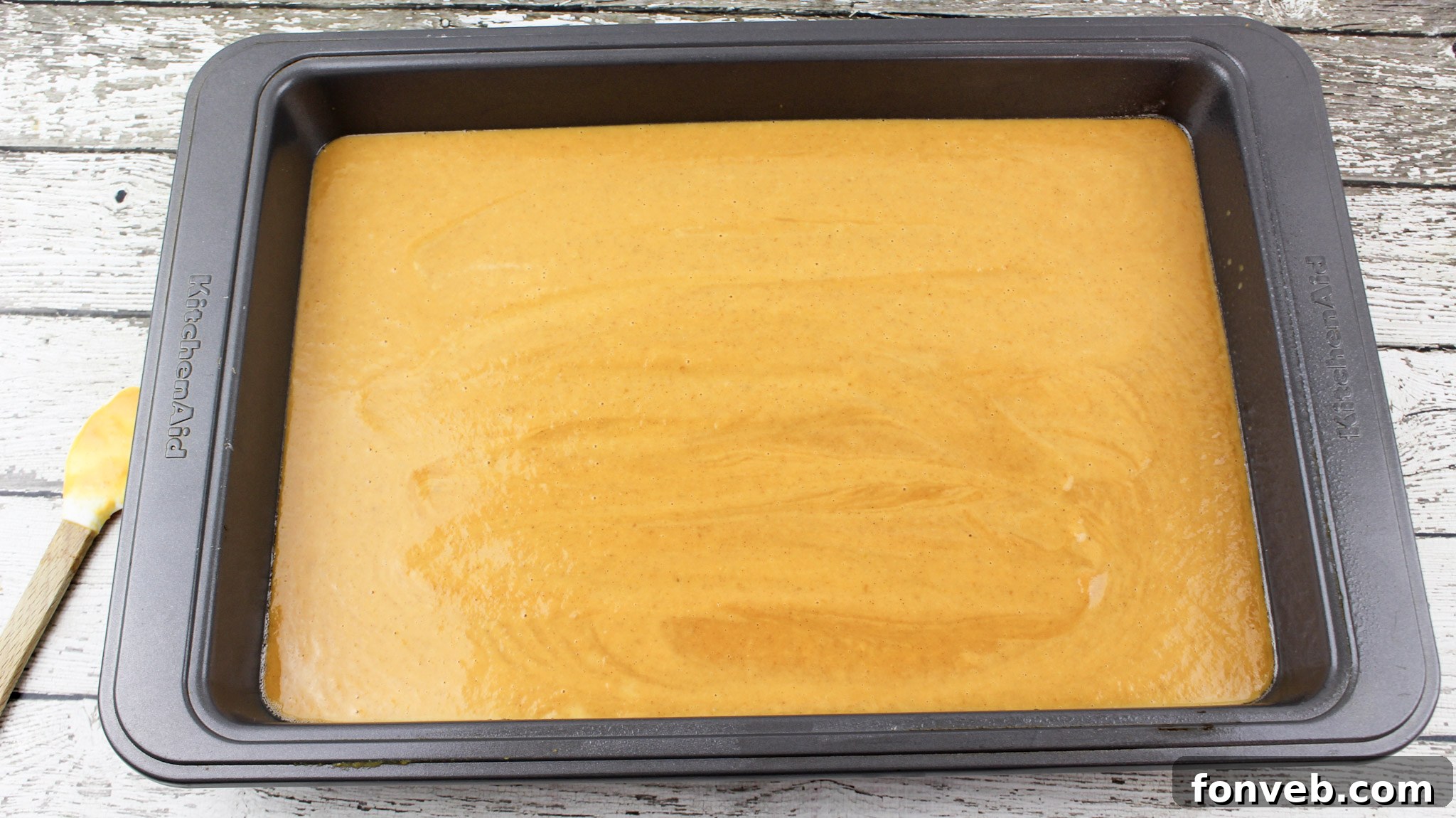 Easy Pumpkin Pecan Dump Cake 6 Pumpkin mixture in a baking dish, forming the first layer of the dump cake