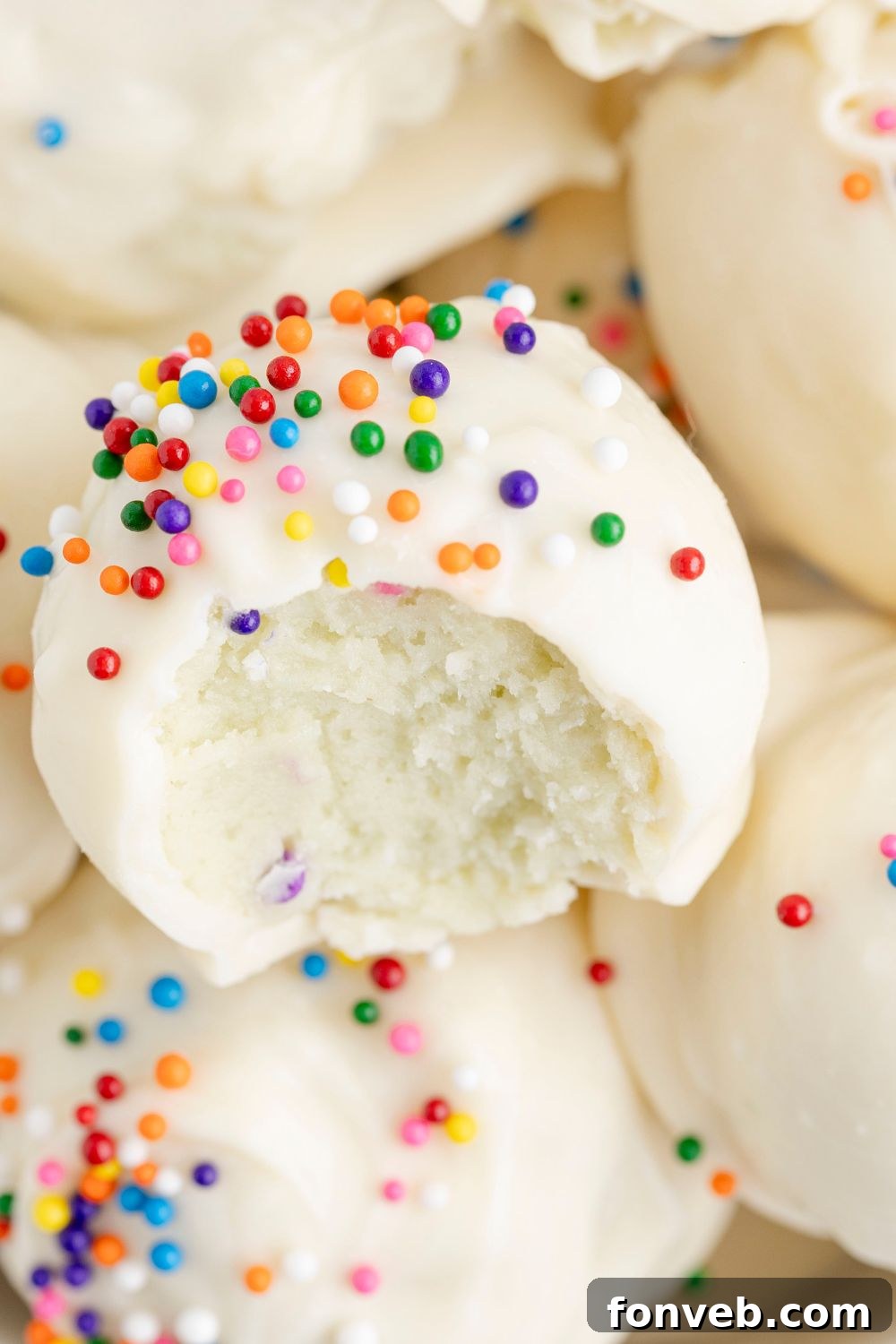 Lofthouse Sugar Cookie Truffles with a bite taken out of it 