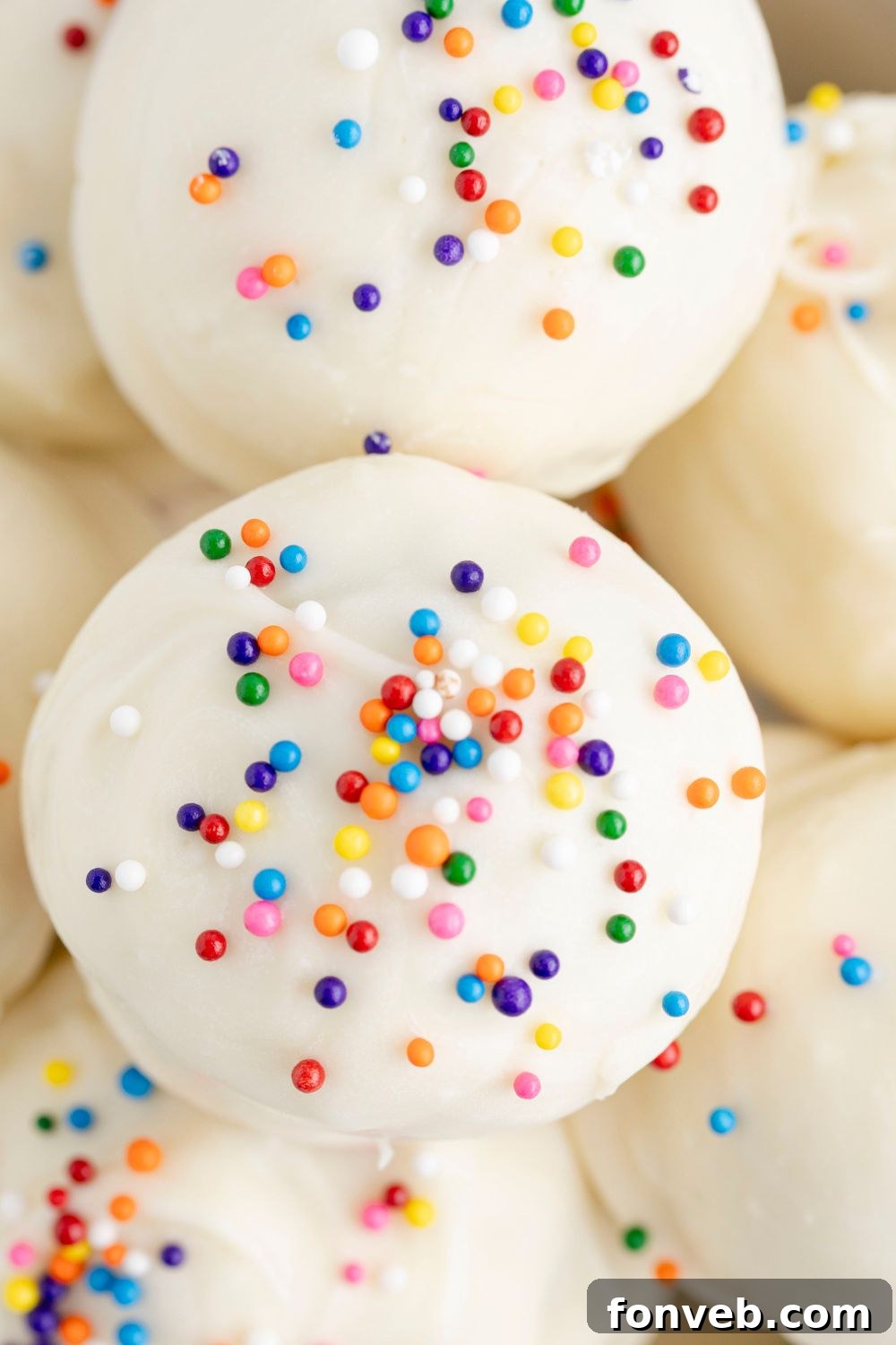 close up truffles in a bowl with sprinkles 