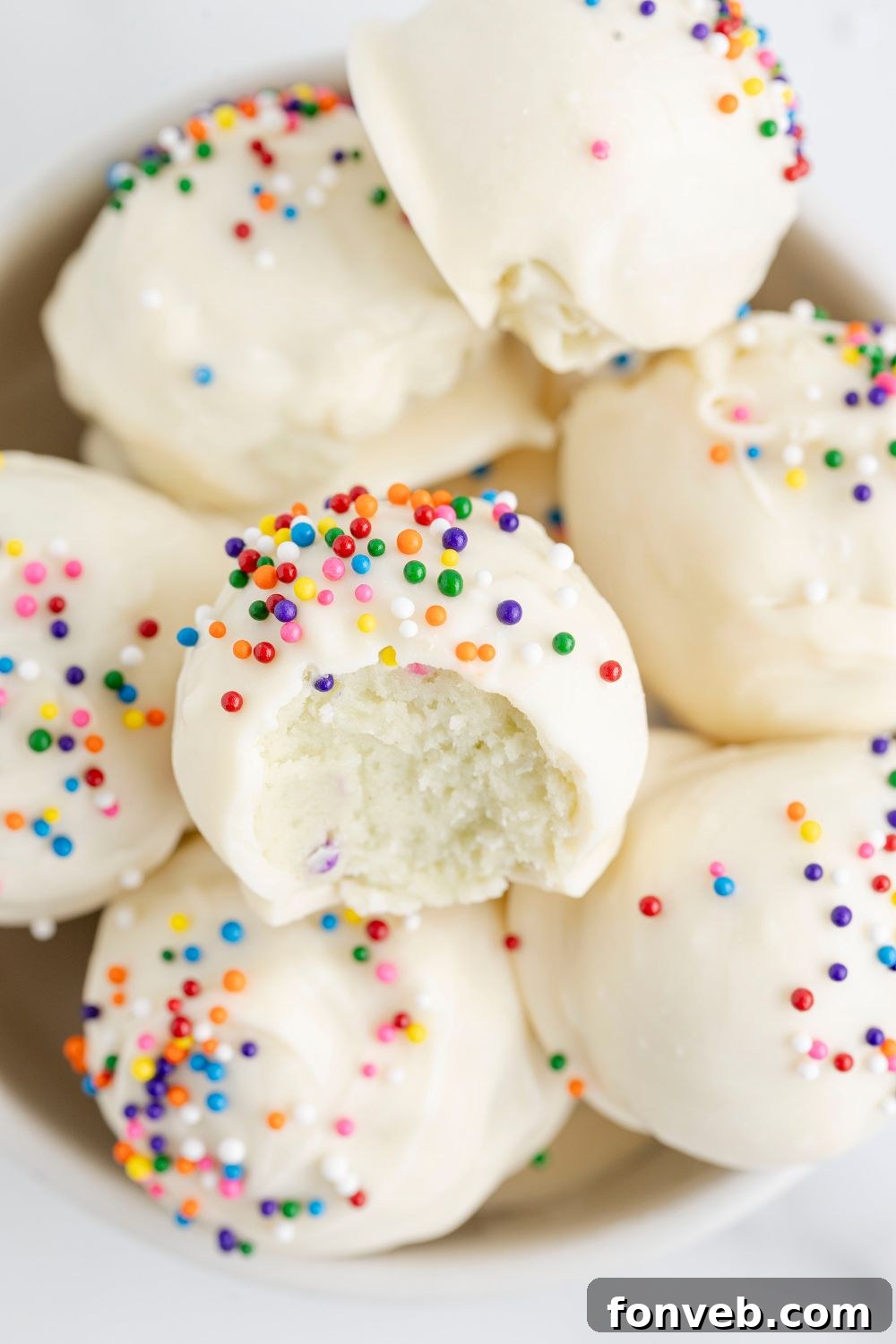 sugar cookie truffles in a white bowl on table
