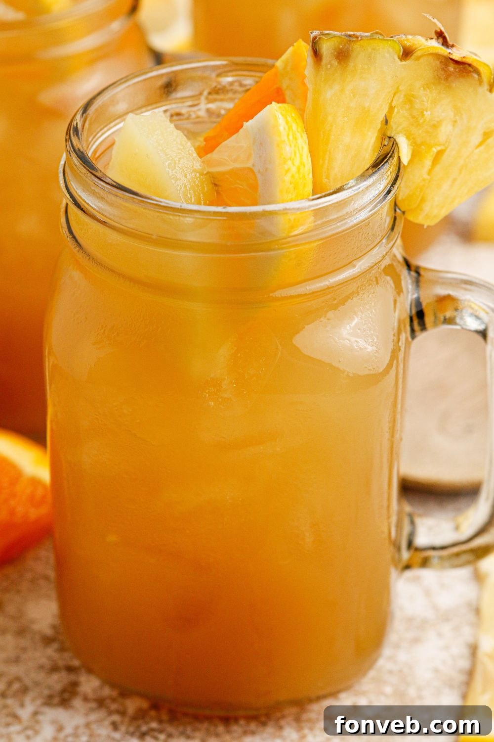 Endzone Chill 11 Mason jar filled with sweet tea cocktail, garnished with fruit.