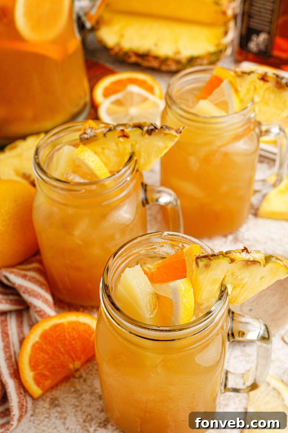 Endzone Chill 14 Glasses of Touchdown Tea on a table with fruit slices around them.