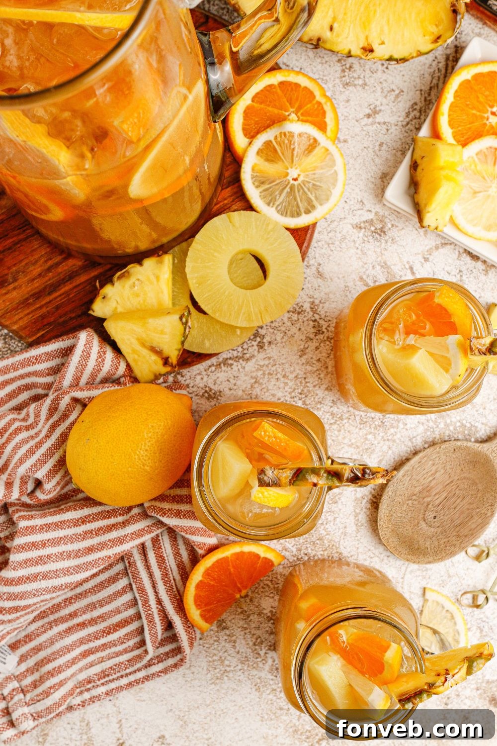 Endzone Chill 16 Twisted tea drinks in glasses with a pitcher containing some tea mixture.