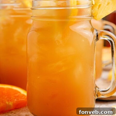 Endzone Chill 22 Touchdown Tea in a mason jar garnished with fruit