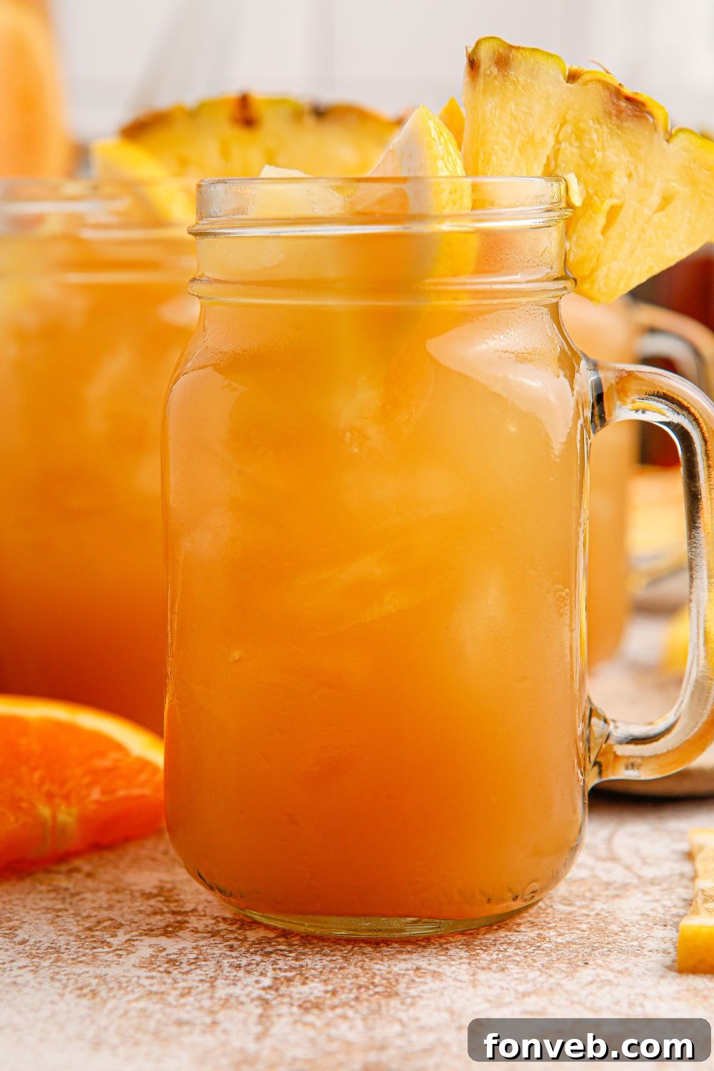 Endzone Chill 4 A mason jar filled with Touchdown Tea, garnished with fresh fruit slices.