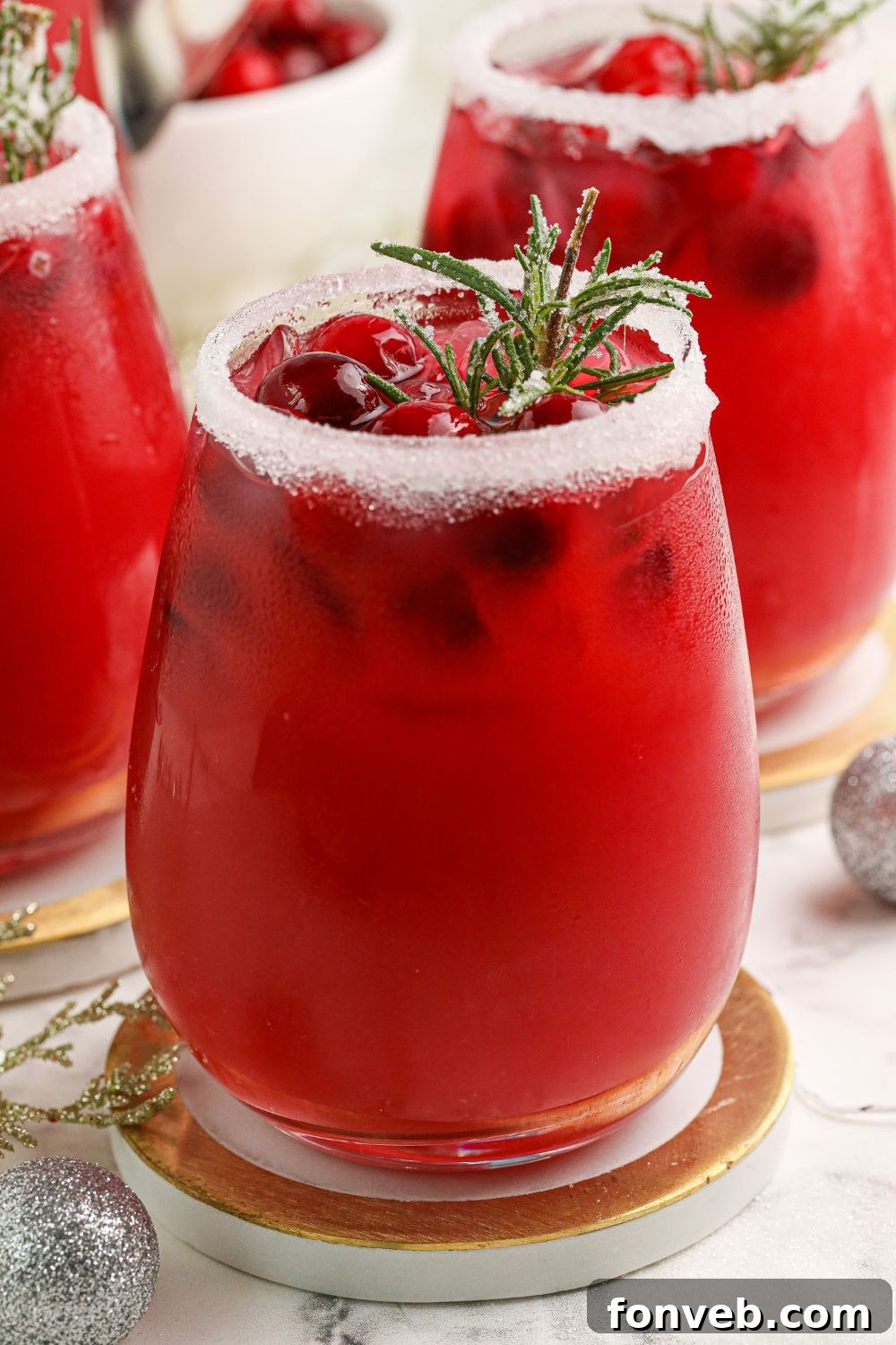 Mistletoe Magic Margarita 4 Multiple Mistletoe Margaritas artfully arranged on a table, ready for a festive gathering.