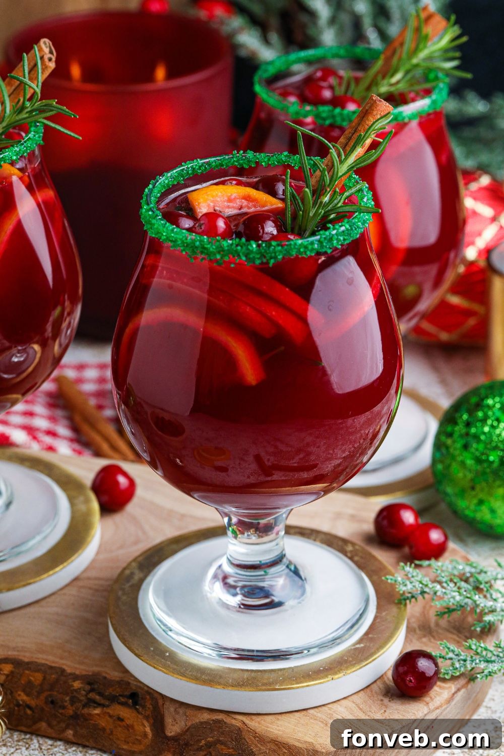 Christmas Sangria on table with berries around it on table 