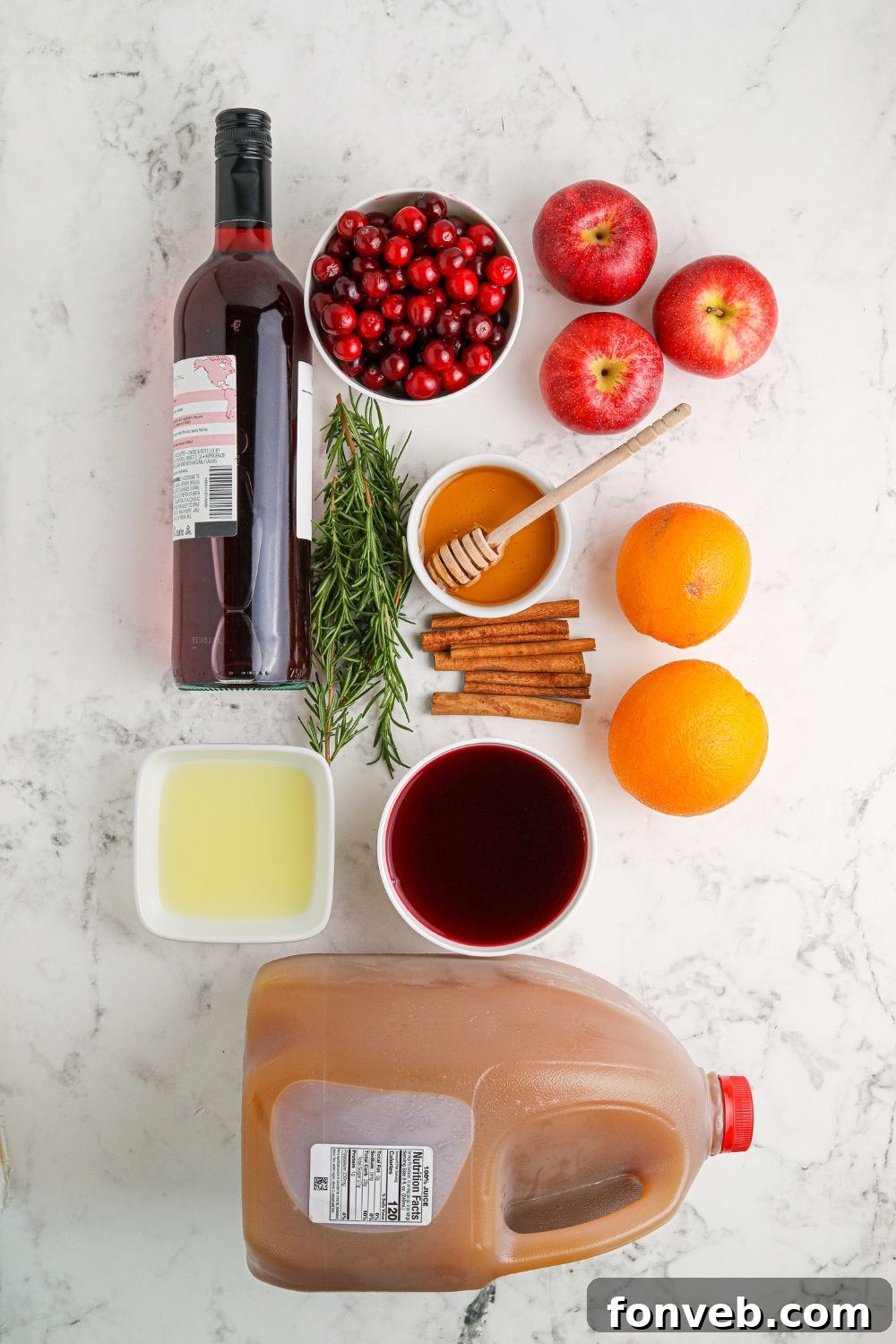 Christmas Sangria ingredients on table laid out nicely 