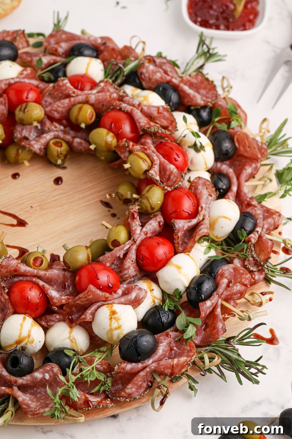 Christmas themed appetizer skewers with tomatoes, cheese, and meat
