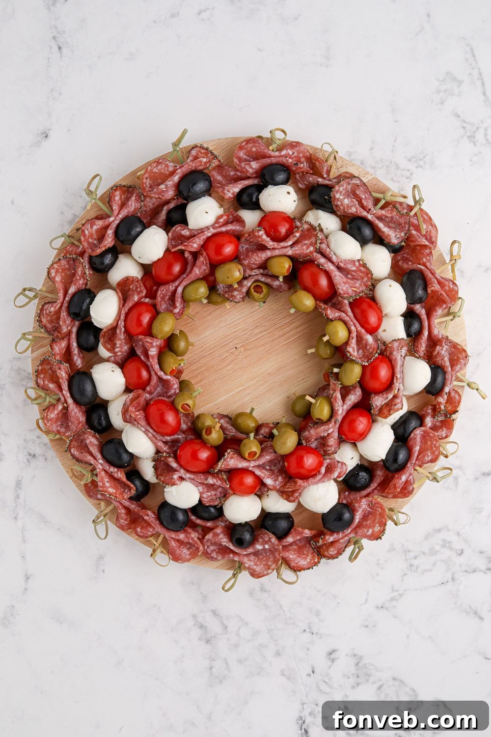 Looking down at a wreath-shaped appetizer on a table