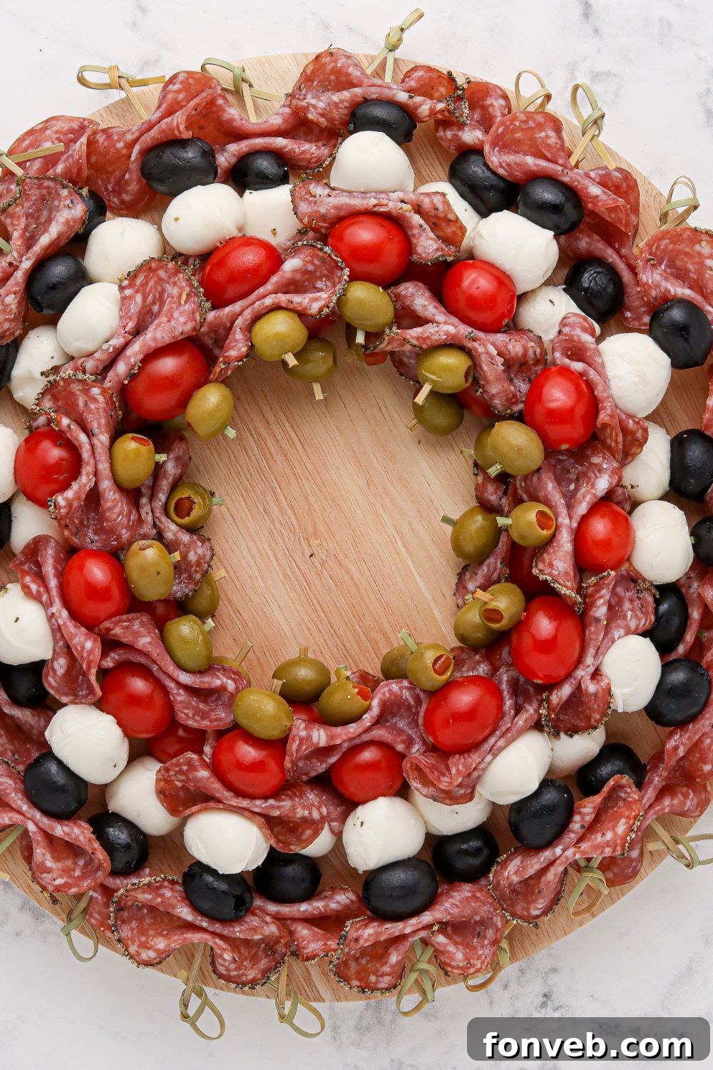 Assembled antipasto skewers arranged in the shape of a wreath