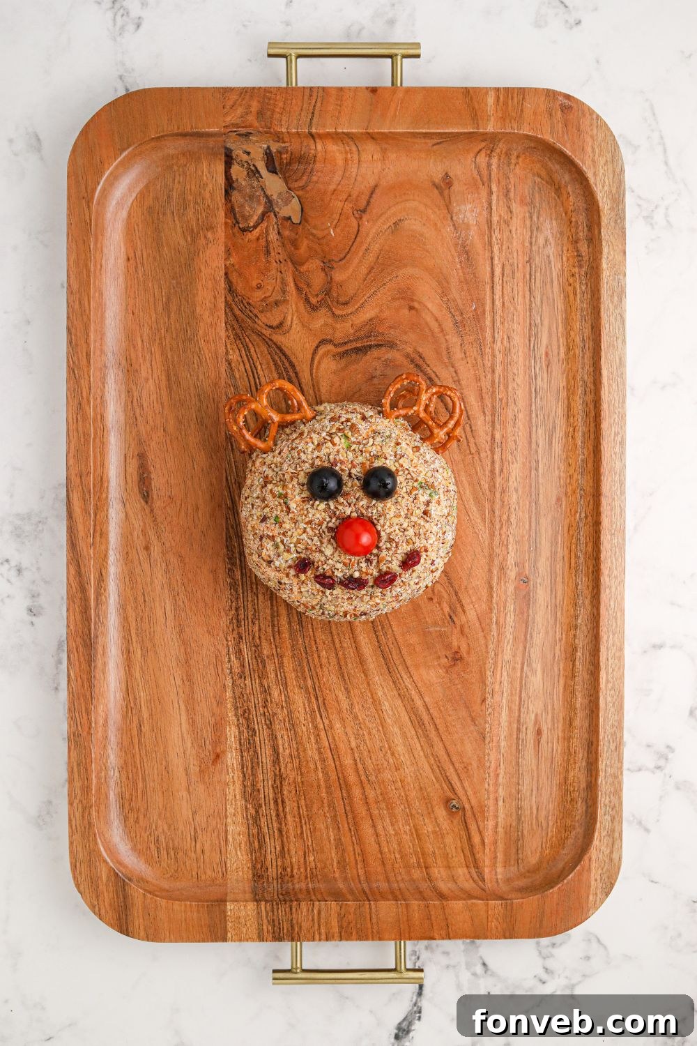 Rudolph's Holiday Charcuterie Platter 8 Rudolph cheeseball positioned on a wooden tray