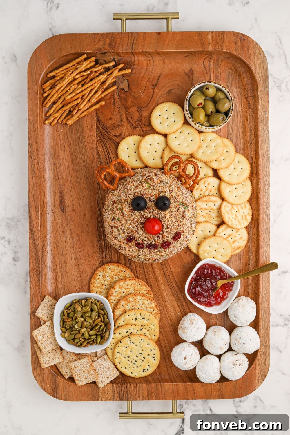 Rudolph's Holiday Charcuterie Platter 9 Rudolph cheeseball being assembled with snack board items