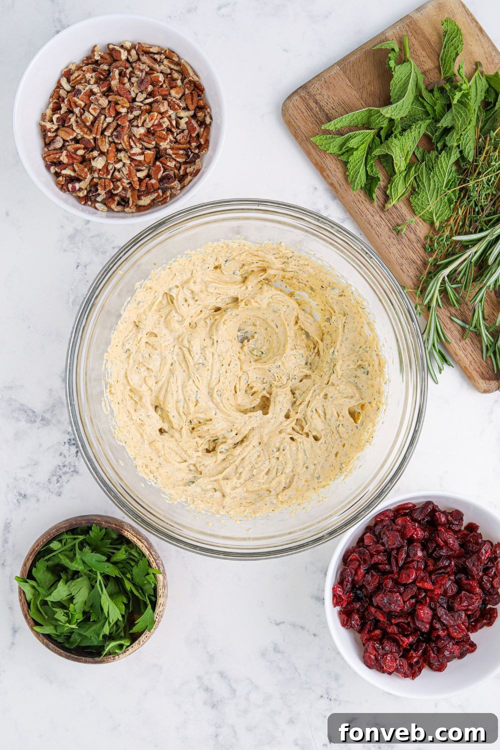 Close-up of a bowl filled with ranch cheese ball mixture, smooth and ready for shaping.