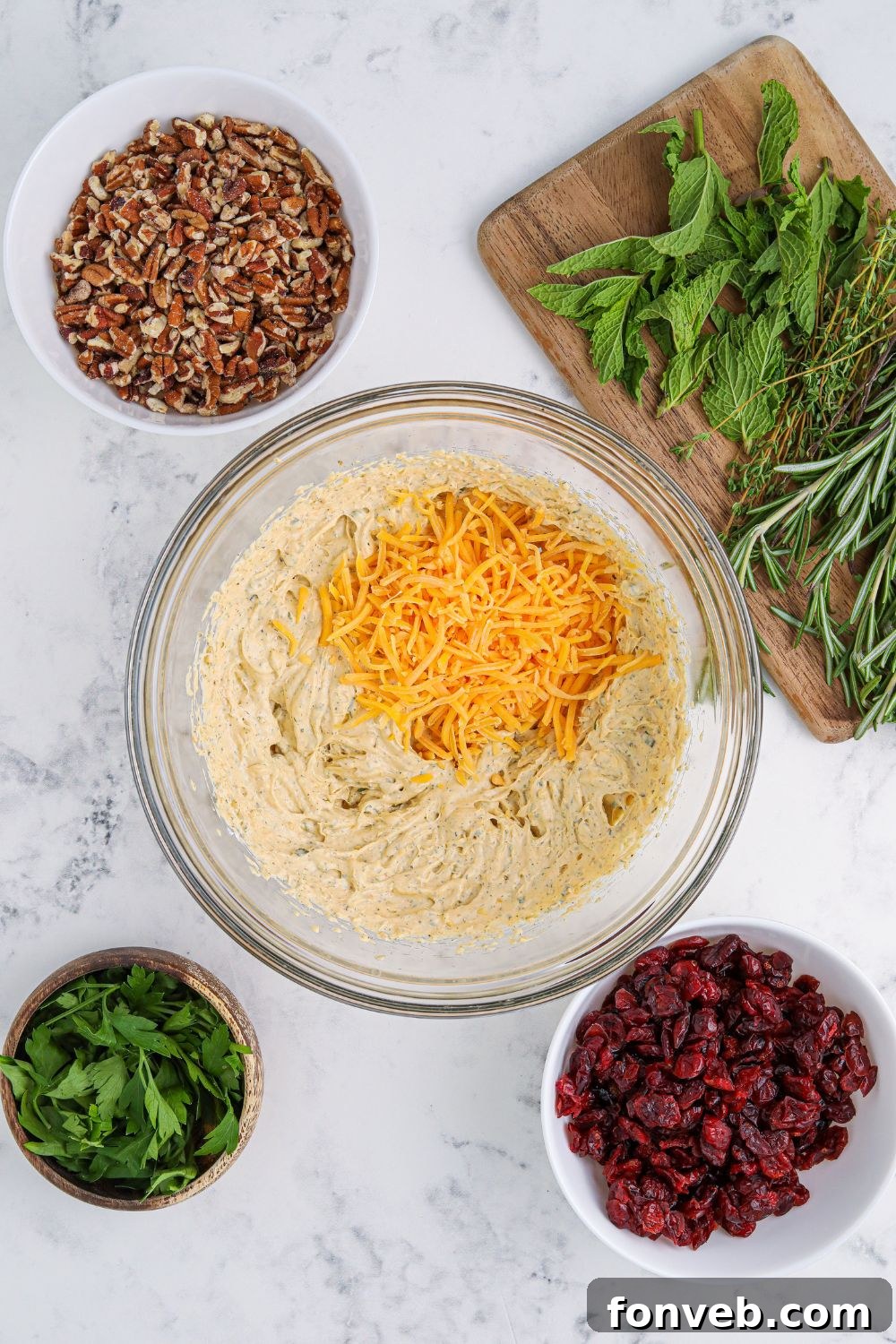 Various ingredients for the cheese ball fillings combined in separate bowls, ready for mixing.