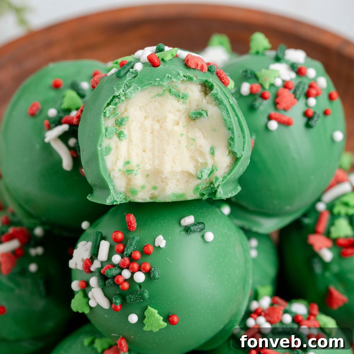 Lofthouse's Signature Christmas Truffles 2 Lofthouse Christmas Truffles in a bowl with one has a bite taken out of it