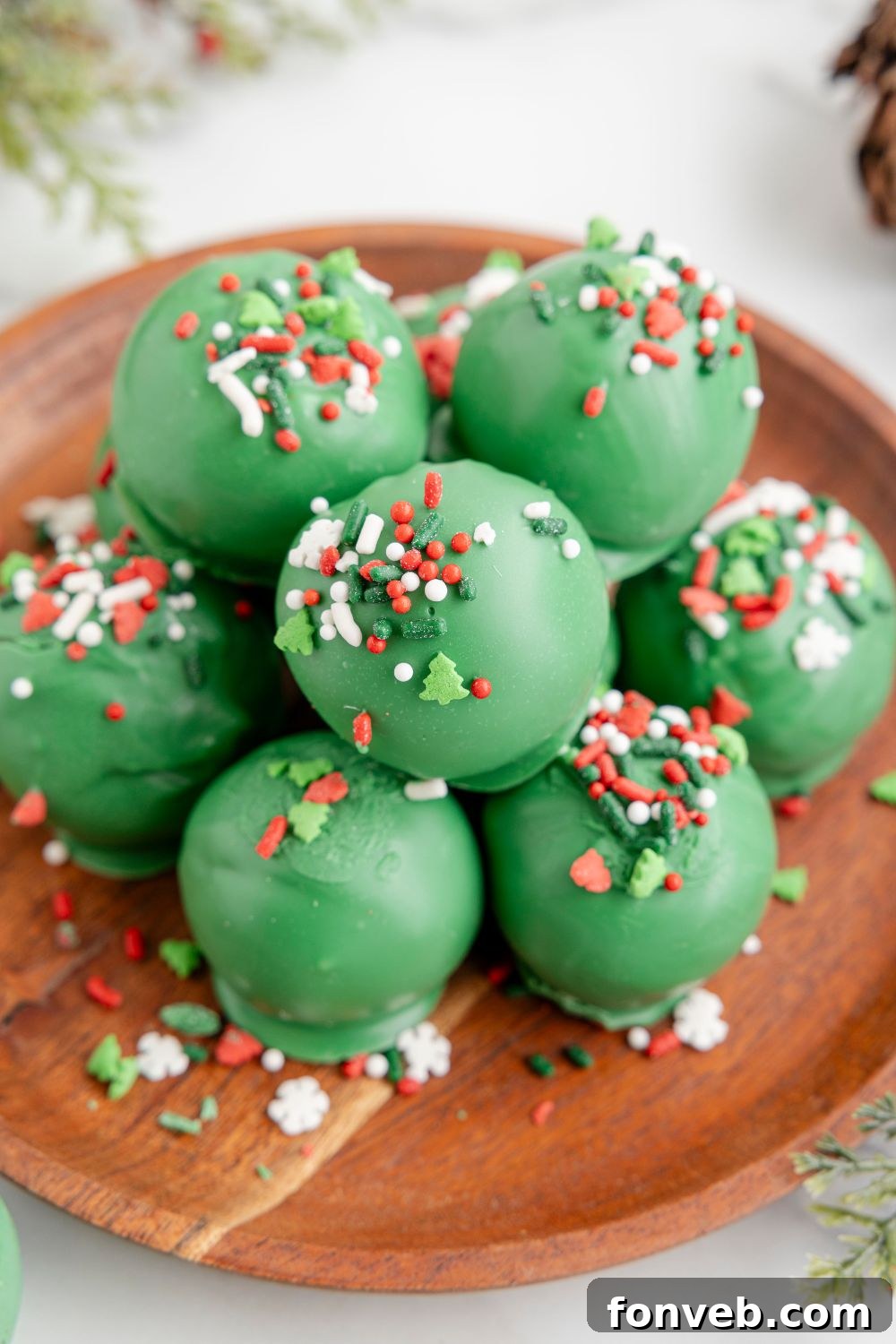 Lofthouse's Signature Christmas Truffles 13 Lofthouse Christmas Truffles on a platter with sprinkles around it