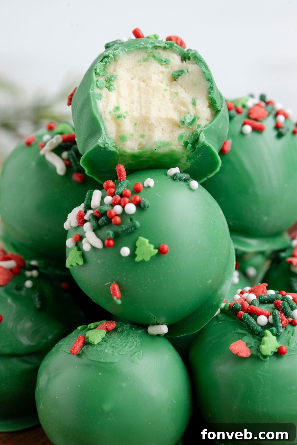 Lofthouse's Signature Christmas Truffles 15 truffles stacked on platter with one with a bite taken out