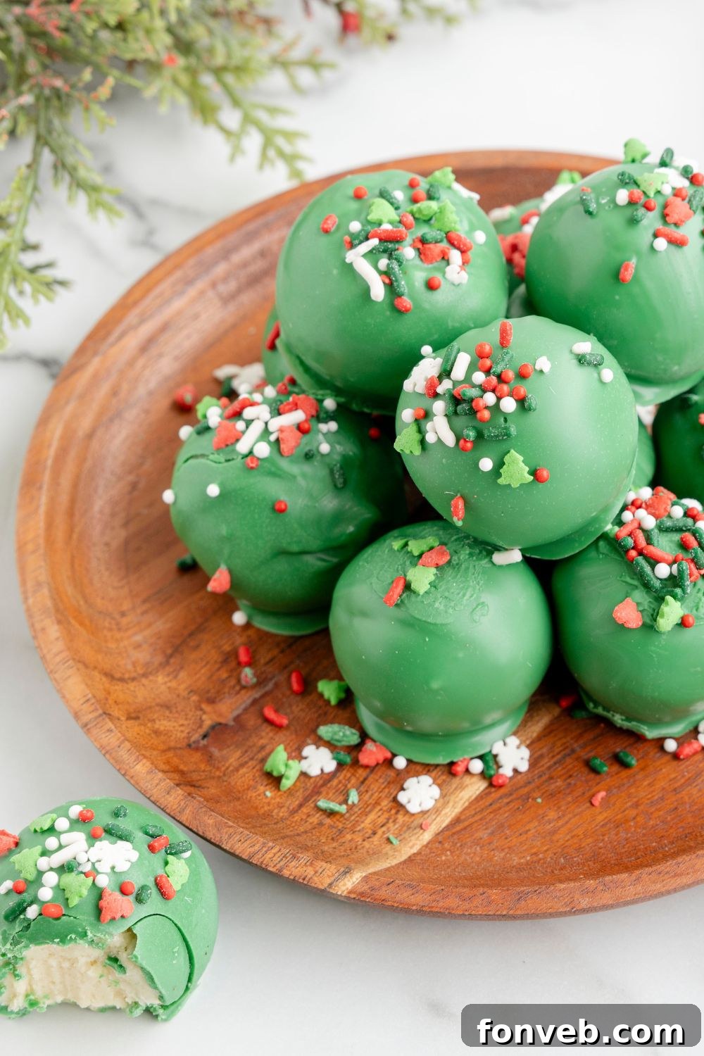 Lofthouse's Signature Christmas Truffles 18 cookie truffles on a wooden plate