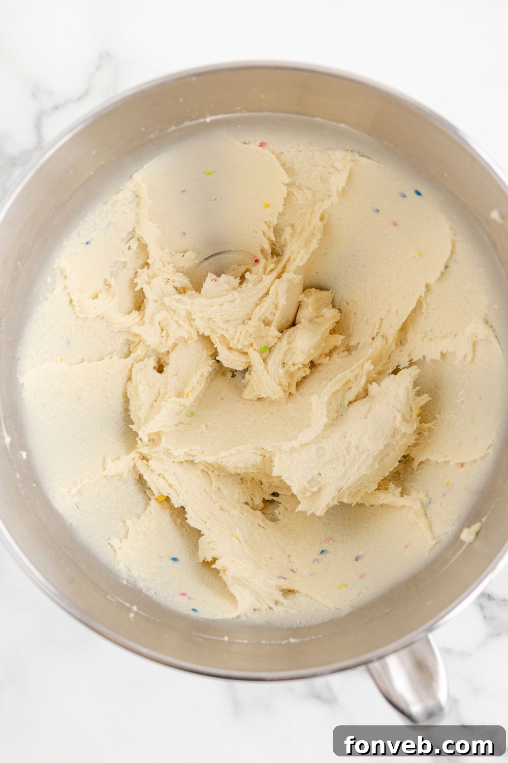 Lofthouse's Signature Christmas Truffles 7 batter of sugar cookie truffles mixed in a mixing bowl