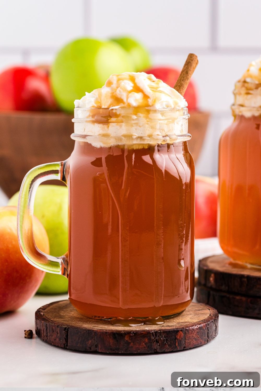 Cozy Caramel Apple Brew 13 A simple mug of amber-colored cider on a table, ready to be savored.